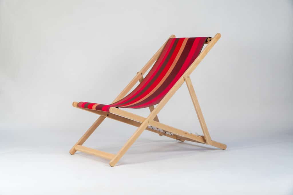 Beechwood Deckchair with Cordoba fabric red, brown, black and grey stripes, viewed from an angle - created by Decks and Stipes Ireland