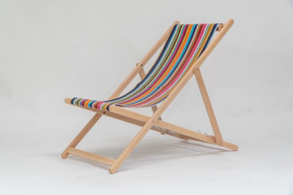 Beechwood Deckchair with Paintballing fabric, blue, green, orange, yellow pink and red stripes, viewed from an angle - created by Decks and Stipes Ireland