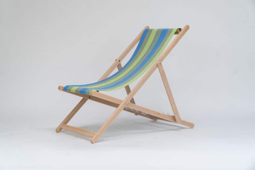 Beechwood Deckchair with Pickleball fabric, sky blue, lime, yellow, jade, terracotta and charcoal stripes, viewed from an angle - created by Decks and Stipes Ireland