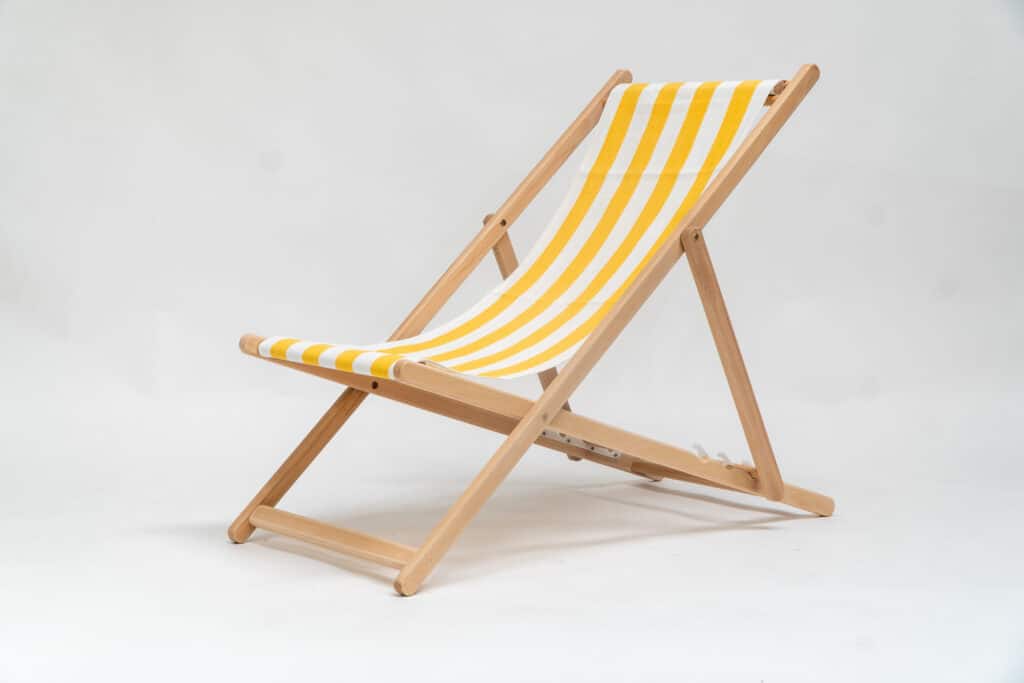 Beechwood Deckchair with Shot Put fabric, yellow & white stripes, viewed from an angle - created by Decks and Stipes Ireland