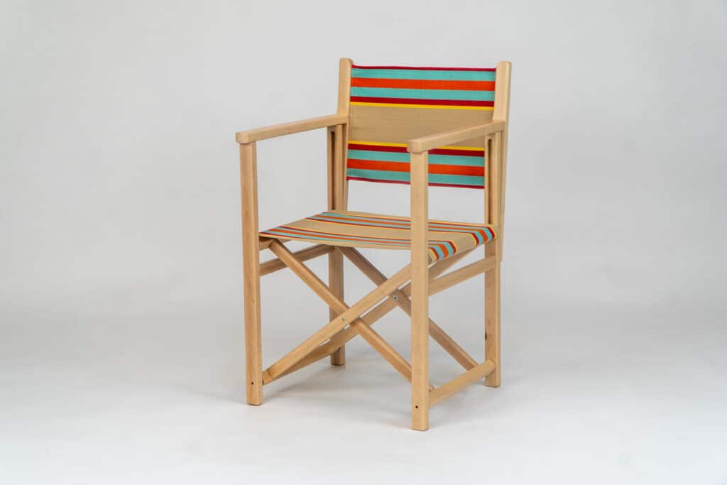 Beechwood Director's Chair with Dice Fabric, fawn, terracotta, turquoise, red and stripes, yellow, viewed at an angle - created by Decks and Stipes Ireland