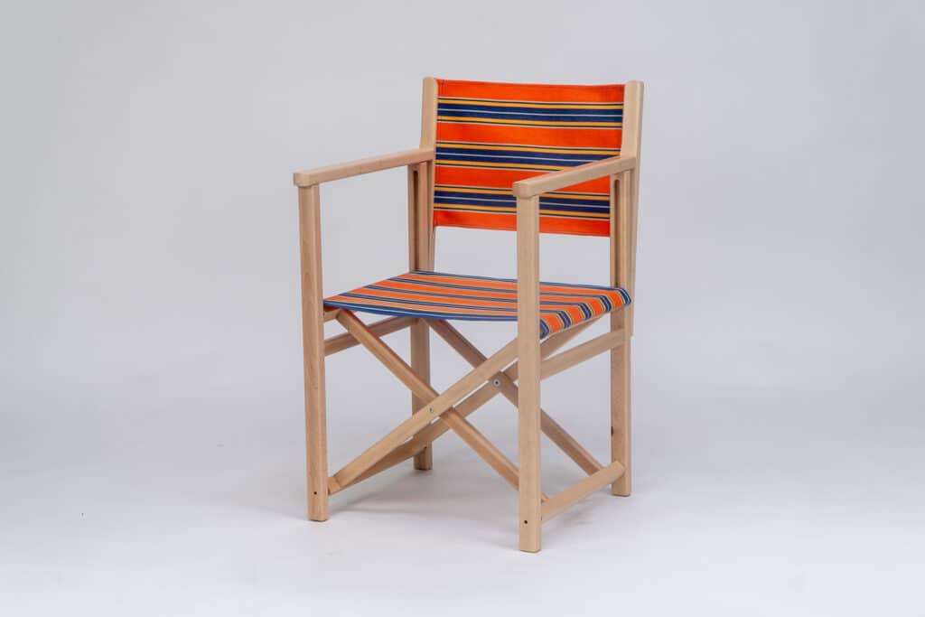 Beechwood Director's Chair with Jazz fabric, rust, blue, yellow, white and black stripes, viewed from an angle - created by Decks and Stipes Ireland