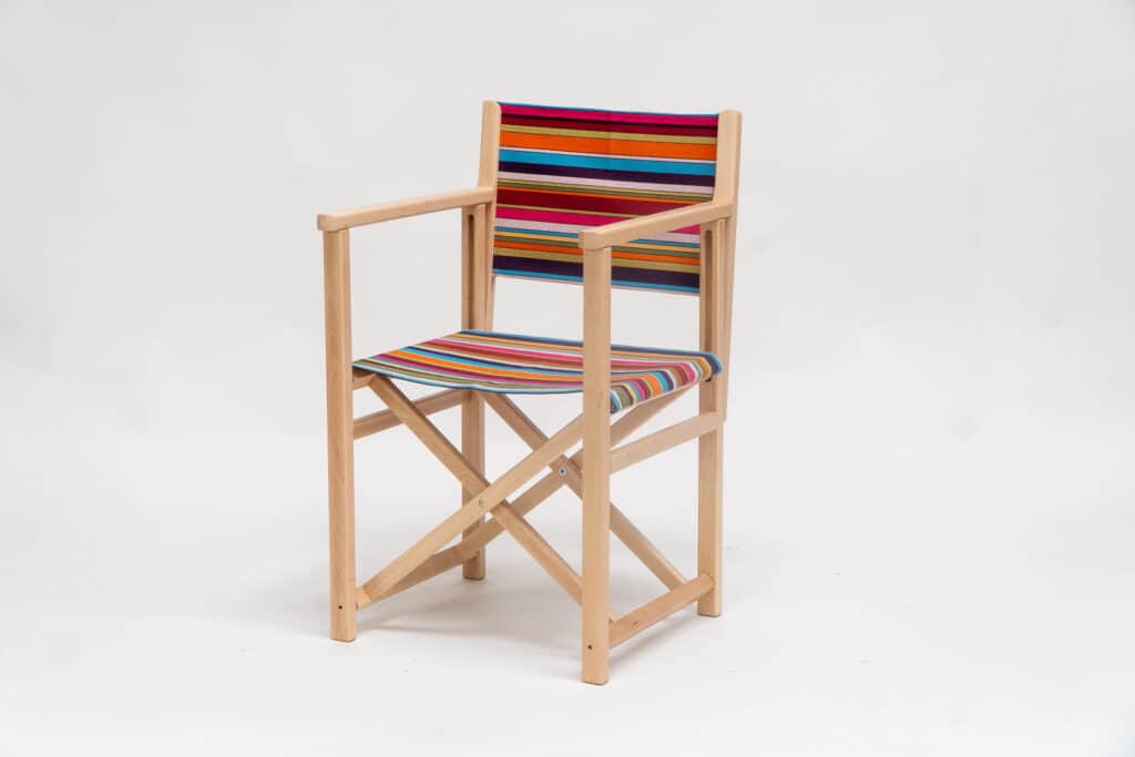 Beechwood Director's Chair with Paintballing fabric, blue, green, orange, yellow pink and red stripes, viewed from an angle - created by Decks and Stipes Ireland