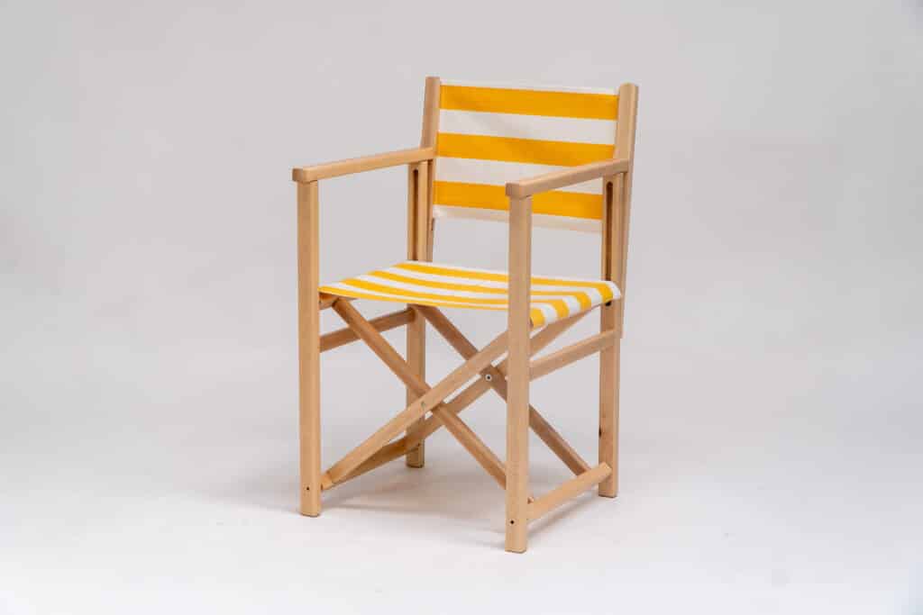 Beechwood Director's Chair with Shot Put fabric, yellow & white stripes, viewed from an angle - created by Decks and Stipes Ireland