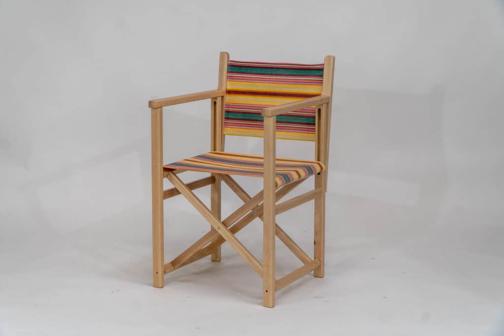 Beechwood Director's Chair with Waltzing fabric, yellow, pink, green, lavendar and white stripes, viewed at an angle - created by Decks and Stipes Ireland