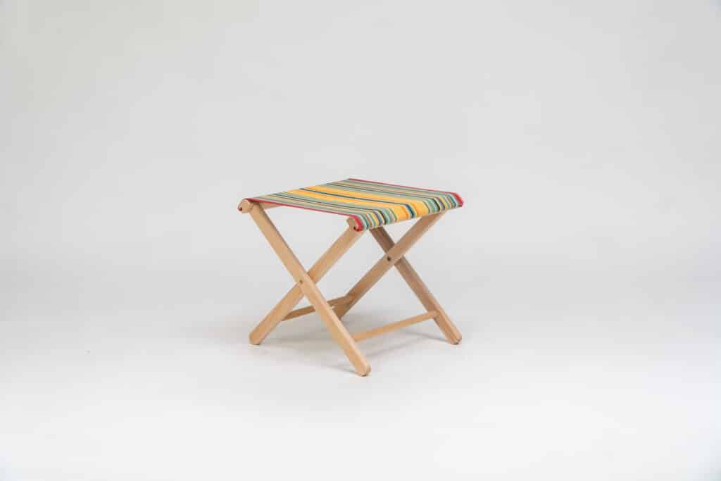 Beechwood Stool with Medley fabric, red, orange, green, black, yellow and blue stripes - created by Decks and Stipes Ireland